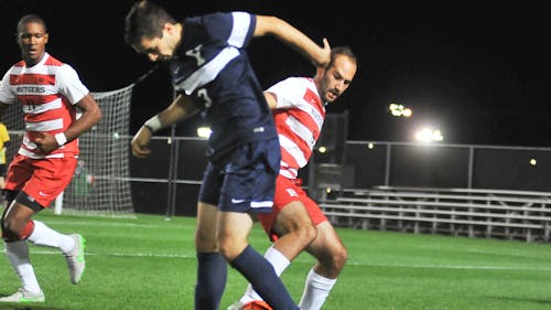 Senior forward JP Correa makes a play on the ball on Yale’s Tyler Detorie. Correa tallied two goals for Rutgers in the 5-2 victory. – Photo by Edwin Gano
