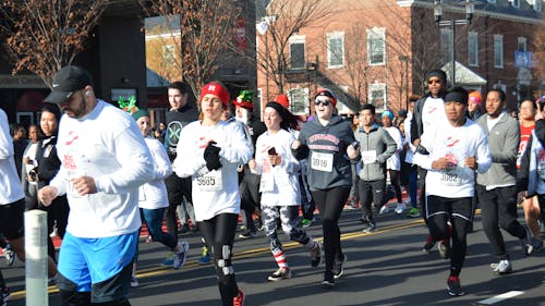 More than 7,000 students, alumni, faculty and guests laced their running shoes early Saturday morning for “The Big Chill” 5-kilometer. The yearly fundraising effort, hosted by the University, collects toys for children ages 3 to 14. – Photo by Casey Ambrosio