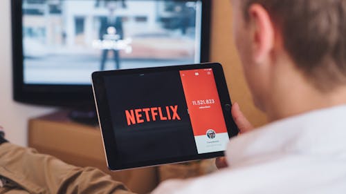 As Netflix shifts toward including commercials on its platform, this change is ultimately a product of living in an increasingly capitalist society. – Photo by CardMapr.nl / Unsplash