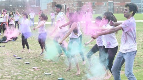 About 1,800 students playfully emptied packets of powdered flower petals on themselves, their friends and strangers Friday afternoon for Rutgers’ “Holi Moli,” on the Livingston campus to celebrate the Hindu tradition, Holi. Holi, also known as the “Festival of Colors” or the “Festival of Love,” is a spring celebration widely celebrated in areas of South Asia and is meant to welcome the arrival of spring and the end of winter, as well as the triumph of good over evil. MICHELLE KLEJMONT / MANAGING EDITOR – Photo by Michelle Klejmont