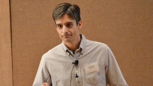 Samir Shubeits speaks at the ‘28th Annual Laboratory for Surface Modification Symposium-Advances in Nanoscale Materials Imaging.’ – Photo by Daphne Alva