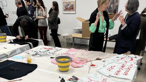 Attendees of the Zimmerli Art Museum's SparkNight: Women's History Month event were invited to express themselves by painting on fabric. – Photo by Yassmin Elmouzaieg