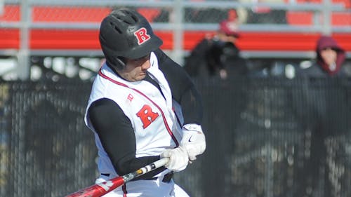 Fifth-year senior first baseman Chris Suseck swings to hit a 3-run home run that propelled Rutgers to a 11-3 win over Lafayette in its home opener Wednesday. Suseck had a career day at the plate, going 4-for-5 and driving in 5 runs. – Photo by Dimitri Rodriguez