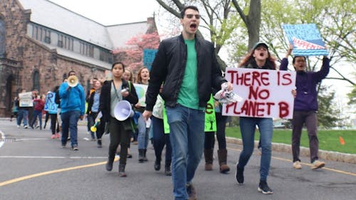 Students marched from the Brower Commons steps to College Hall on Friday afternoon for the fourth annual Rutgers Earth March. Among the participants were representatives from the Rutgers Student Environmental Coalition, RU Progressive and the Rutgers Veg Society. – Photo by Jeffrey Gomez