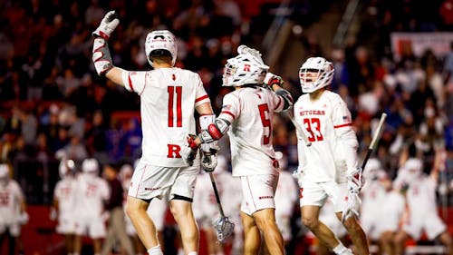 Senior attackers Brian Cameron and Ross Scott, junior midfielder Jack Aimone and the Rutgers men's lacrosse team earned a thrilling overtime victory in a crucial conference matchup at home against Michigan. – Photo by Ariel Fox / ScarletKnights.com