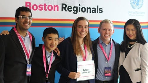 Members of SULIS stand aside Sophia Zhou, the campus director of the Hult Prize at Rutgers, at the Boston Regional Competiton where they took home the Hultz Prize.  – Photo by Facebook