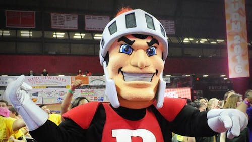 Students who don the mask and suit of the Scarlet Knight are tasked with bringing the mascot to life in the eyes of the fans at the events they attend. – Photo by Dimitri Rodriguez