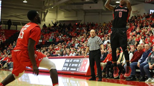 Junior guard Nigel Johnson shoots a three in the second half of Rutgers 71-66 win over Stony Brook at the Island Federal Credit Union Arena Saturday night. Johnson led the Knights with a career-high 21 points. – Photo by Photo by Dimitri Rodriguez | and Dimitri Rodriguez The Daily Targum
