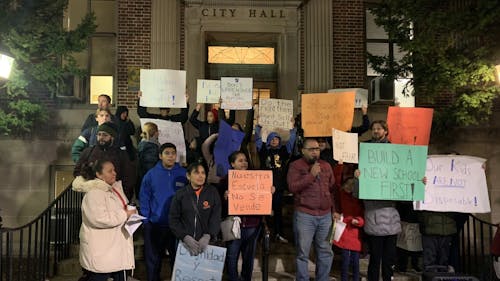 Members of the newly formed Coalition to Defend Lincoln Annex School stood on the steps of City Hall to voice their opposition to the sale of the school. – Photo by Photo by Hayley Slusser | The Daily Targum