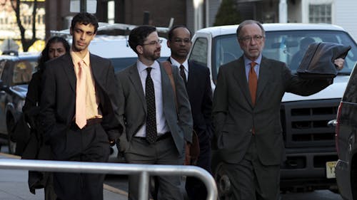 Dharun Ravi and his attorneys Steve Altman and Phillip Nettl enter the Middlesex County Courthouse on Wednesday before the judge explains the 15 counts and 35 charges held against Ravi. – Photo by Jovelle Tamayo
