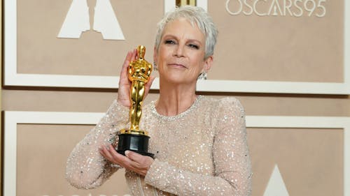 Jamie Lee Curtis' victory in the Actress in a Supporting Role category of the Oscars sparks discussion over the award show's sincerity.  – Photo by @PopBase / Twitter