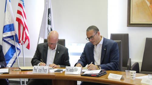 University President Jonathan Holloway in Israel signed an agreement with Tel Aviv University President Ariel Porat in the fall of 2021. – Photo by Courtesy of Carissa Sestito