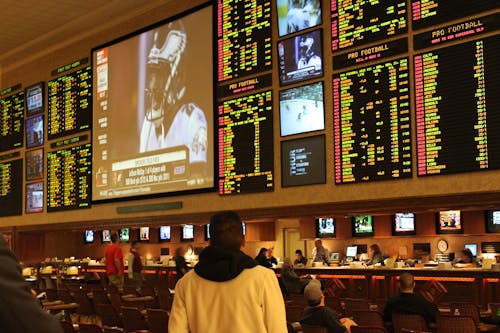 While the rise of sports betting may be helping the sports and gambling industries to grow from an economic standpoint, it is to the detriment of sports consumers. Sports gambling is quickly becoming a dangerous epidemic, legitimized by celebrities and the sports industry itself. – Photo by Baishampayan Ghose / Wikimedia