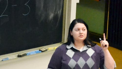 Sabrina Strauss, a graduate student at the University of Notre Dame, discusses her research on super-heavy elements last Thursday at the Physics Lecture Hall on Busch campus. – Photo by Daphne Alva