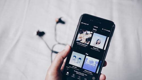 Fall might be on the horizon, but you can still stream these hot summer tracks to transition the seasons. – Photo by Fath / Unsplash
