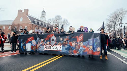 Rutgers United Students Against Sweatshops, alongside other student activist organizations on campus, took to the streets in support of a $15 minimum wage at Rutgers. See more photos of the protest here. – Photo by Declan Intindola