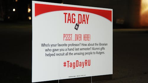 Every year, Rutgers encourages students to donate to the University through Teaching Annual Giving (TAG) day. In preparation for the event, informational tags have been placed all around campus with facts and statistics. – Photo by Jeffrey Gomez