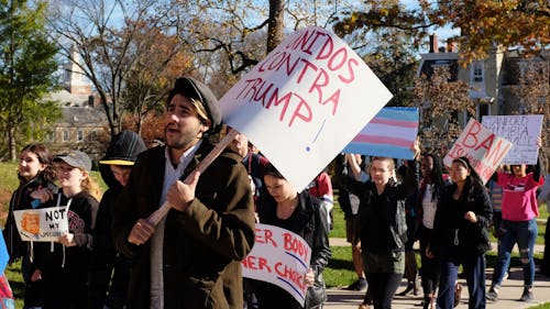 More than 100 students marched down College Avenue and George Street to show their support for minorities and students in the LGBT community after Republican Donald Trump was elected as the next United States President last Tuesday. – Photo by Jason Ye