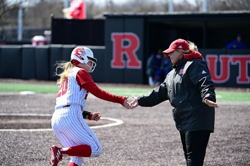 Senior catcher Katie Wingert, head coach Kristen Butler and the Rutgers softball team swept Illinois on the road, thanks to the player's multiple home runs. – Photo by Ben Solomon / ScarletKnights.com