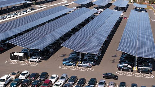 Rutgers is planning to add more solar panels to parking lots on several campuses throughout the year as part of its commitment to reducing its carbon footprint for electricity by 2030. – Photo by @rutgersalumni / Twitter