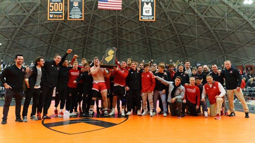 The Rutgers wrestling team needed a bonus match point to defeat rival Princeton to retain the New Jersey-shaped B1G-Ivy Trophy. – Photo by @RUWrestling / Twitter