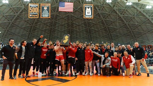 The Rutgers wrestling team needed a bonus match point to defeat rival Princeton to retain the New Jersey-shaped B1G-Ivy Trophy. – Photo by @RUWrestling / Twitter