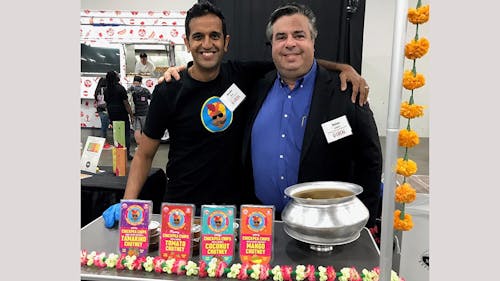 Nolan Lewin, acting executive director and director of operations of the Food Innovation Center (FIC) standing with Anshu Dua, co-founder of the Chaat Company. – Photo by Rutgers.edu