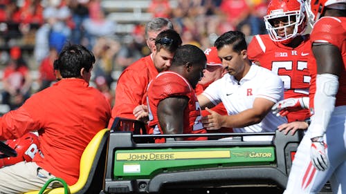 Senior defensive end Quanzell Lambert gets carted off the field after sustaining an injury in the fourth quarter of Rutgers' 14-7 loss to Iowa Saturday. Head coach Chris Ash announced the injury is season-ending Monday, bringing Lambert's collegiate career to an end. – Photo by Dimitri Rodriguez