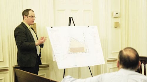 Matthew Snethen, an architect for Ehrenkrantz, Eckstut and Kuhn,
details plans for the Gateway project at the New Brunswick Planning
Board meeting last night in City Hall Council Chambers. The board
passed an amendment that will make minor changes to the project
plans. – Photo by Jennifer Lugris