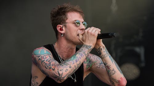 Machine Gun Kelly earned his first-ever number one album on the Billboard Hot 200 chart with his latest drop "Tickets to My Downfall."  – Photo by Wikimedia
