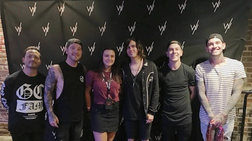 The Daily Targum's own Victoria Yeasky, a Rutgers Business School junior, proves she did, in fact, have an iconic emo era as she poses with rock band Sleeping With Sirens. – Photo by Tori Yeasky