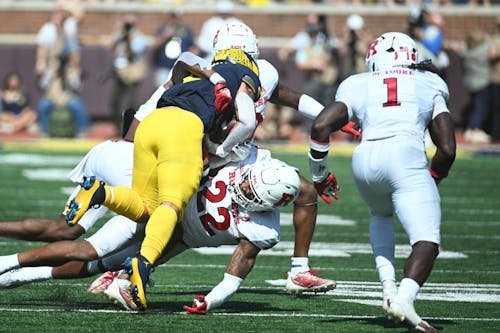 Senior linebacker Mohamed Toure and junior linebacker Tyreem Powell helped keep the Rutgers football team within striking distance in the first half, but Michigan pulled away in the second half. – Photo by Tim Fuller / ScarletKnights.com