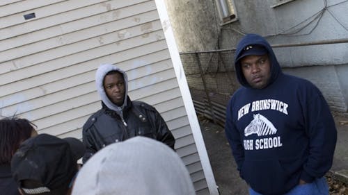 Nate Deloatch, left, Tommie Deloatch and Walter Hudson, family
spokesman, not pictured, hold a press conference to respond to a
statement by Lawrence Bitterman yesterday in an alley way where
Barry Deloatch died. – Photo by Jennifer Miguel-HelLman