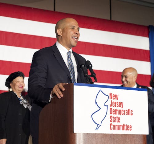 Sen. Cory Booker (D-N.J.) delivers his victory speech in Newark as his family stands besides him after he won re-election for a full term of six years in the Senate. – Photo by Dennis Zuraw