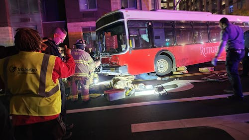 The New Brunswick Fire Department (NBFD) used specialized tools to free a pedestrian from underneath a campus bus after a person was struck by the bus last night.   – Photo by Courtesy of Gunwoo Shin