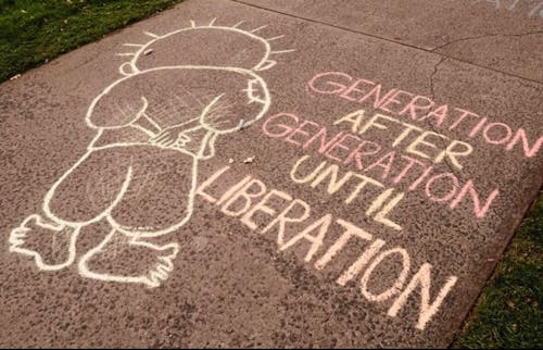 Arooj Amjad, a School of Arts and Sciences junior and art build attendee, said one of the chalk pieces that stood out to her at the event featured Handala, an animated character representing the struggles of Palestinian liberation. – Photo by Photo by @sjprutgersnb / Instagram