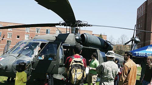 Visitors prepare to take a tour of a helicopter on last year's
Rutgers Day on Busch campus. The event this year will feature
engineering and science activities as well as sporting events. – Photo by The Daily Targum