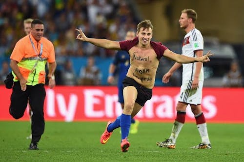 One of YouTube's most infamous pranksters, Vitaly Zdorovetskiy, is emblematic of the extremes people are willing to go for social media clicks, as seen with his stunt during the 2014 World Cup. – Photo by @Am_Blujay / X.com