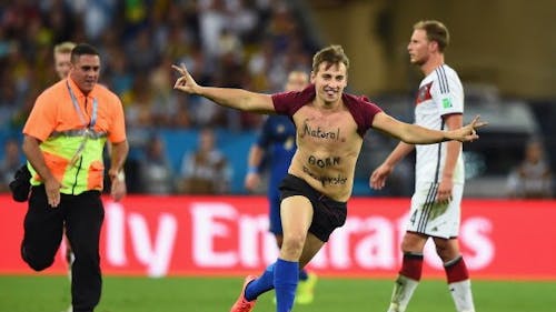 One of YouTube's most infamous pranksters, Vitaly Zdorovetskiy, is emblematic of the extremes people are willing to go for social media clicks, as seen with his stunt during the 2014 World Cup. – Photo by @Am_Blujay / X.com