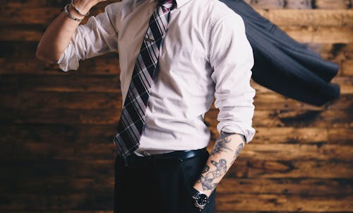It is unethical and unwise for employers to judge job candidates based on visible tattoos or piercings. – Photo by Redd F / Unsplash