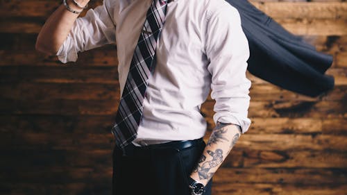 It is unethical and unwise for employers to judge job candidates based on visible tattoos or piercings. – Photo by Redd F / Unsplash