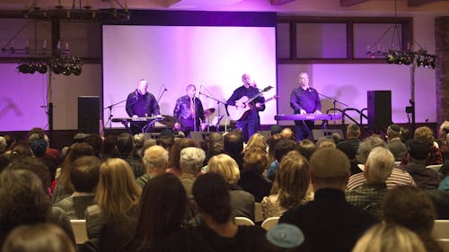 The Jewish folk-rock band Safam chose to make their first appearance in ten years at a housewarming show for the Eva and Arie Halpern Hillel House on Sunday. The live music was accompanied by dinner and a tour of the new facilities. – Photo by Jeffrey Gomez