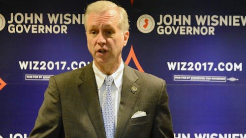 In a town hall in the Douglass Student Center, John Wisniewski pledged to put a voting student member on the University Board of Governors. He also said he would work to minimize student debt in New Jersey by offering free tuition at public universities to families earning less than $125,000. – Photo by Dimitri Rodriguez