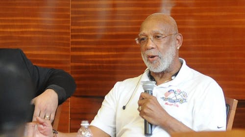 John Carlos, a former U.S. Olympian, spoke about student-athletes in a lecture. They should be considered workers, but are not at present. – Photo by samantha casimir